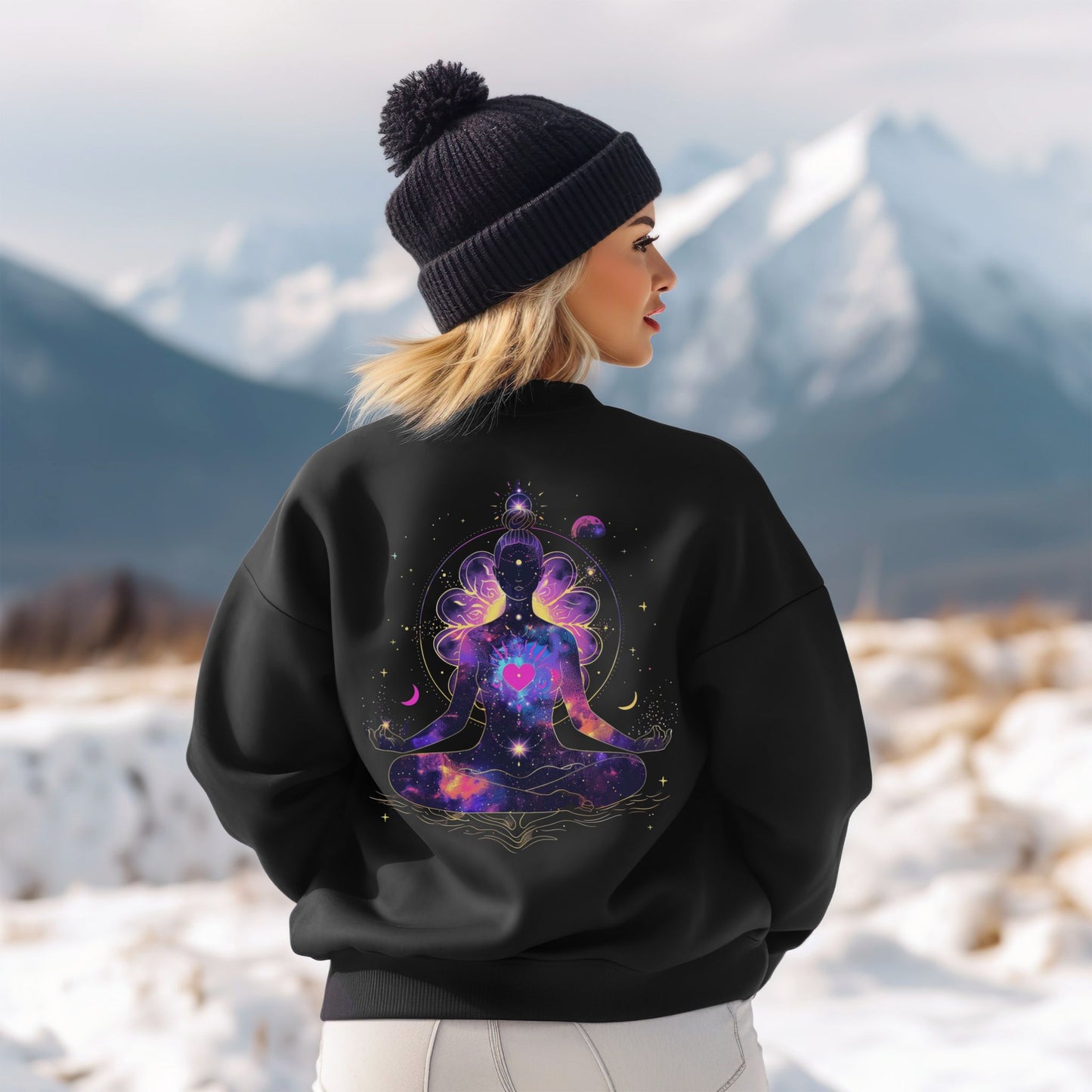 Woman model wearing sweatshirt featuring meditating woman silhouette, cosmic stars, moons, and floral details, a spiritual design – Lunar Lightwear conscious clothing