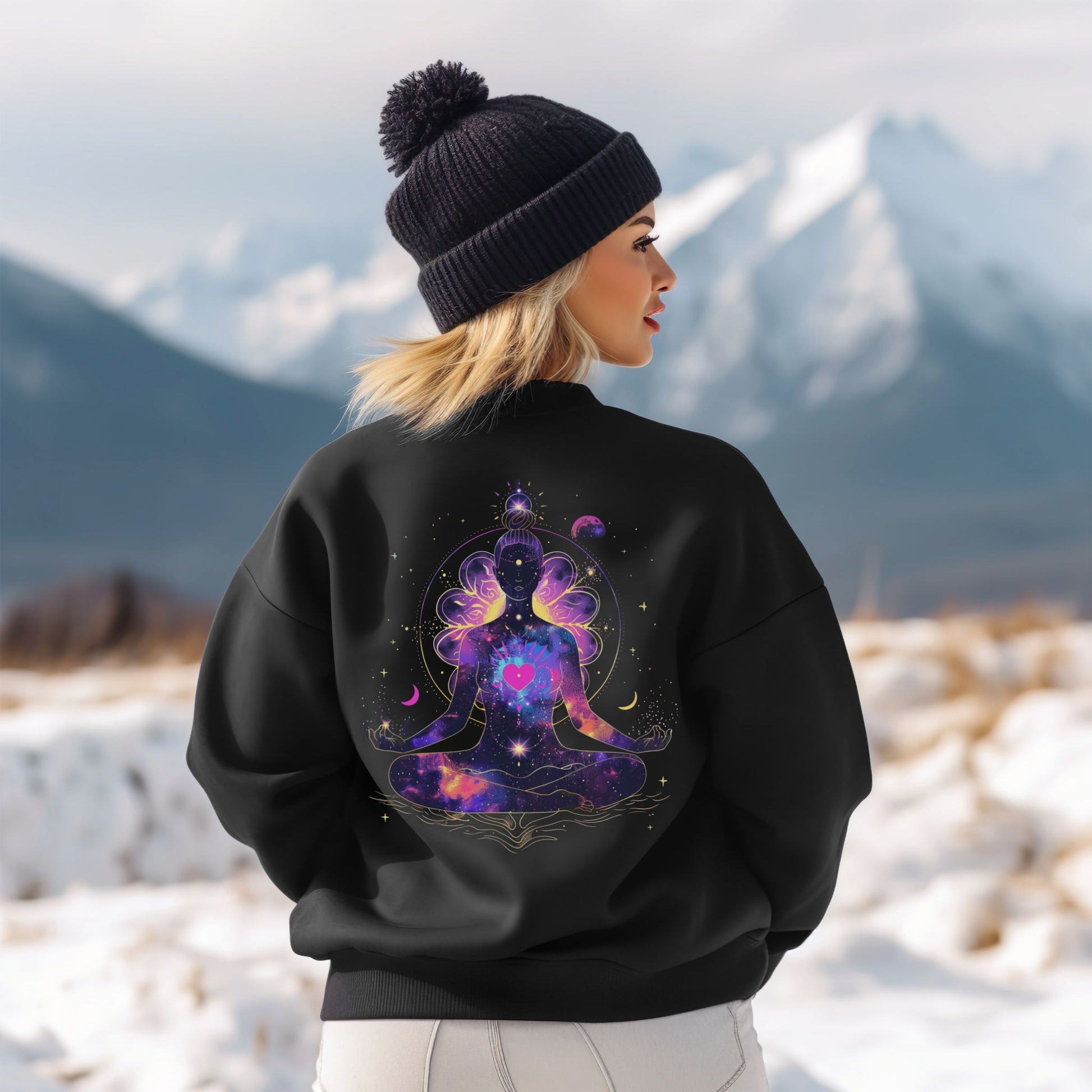Woman model wearing sweatshirt featuring meditating woman silhouette, cosmic stars, moons, and floral details, a spiritual design – Lunar Lightwear conscious clothing
