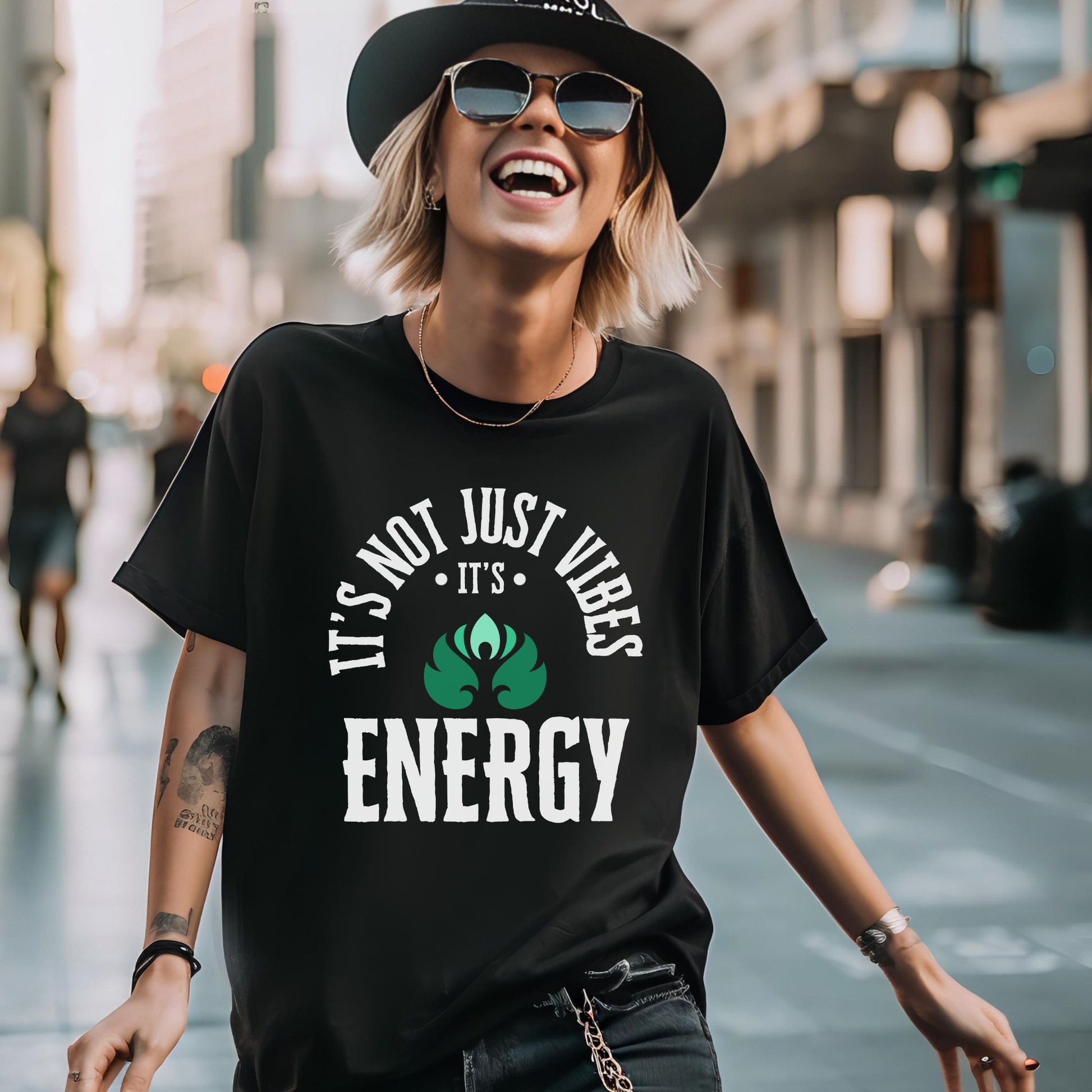 Woman wearing a black t-shirt with a motivational quote on a city street – Lunar Lightwear conscious clothing