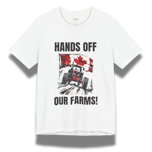 White t-shirt with a graphic design featuring a tractor, Canadian flag, and text 'HANDS OFF OUR FARMS!' on a white background.
