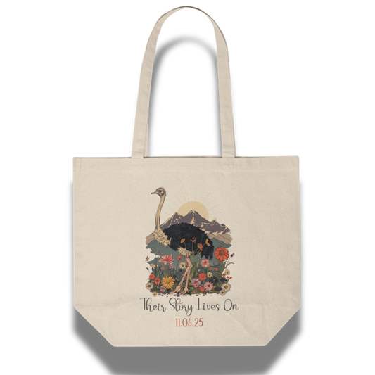 Beige tote bag with an ostrich illustration and floral elements on a white background